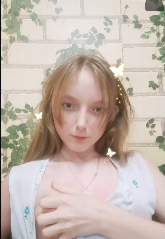 beautiful blonde showing her breasts thumbnail